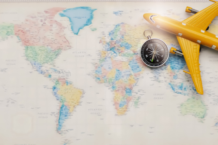 Concept travel tourism, Airplane models and compass placed on the world plate. Space to enter text. Traveling to find yourself and a new experience.の写真素材