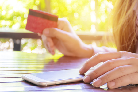 Online shopping concept. Women are buying online with a credit card. Online Shopping Website on Smartphone.の写真素材