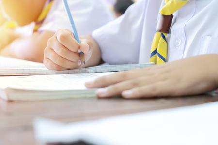 Study concept, learn new things. Students who are holding pencils, Sitting in the classroom is interested in mathematics. Frequent training will help increase skills.の写真素材