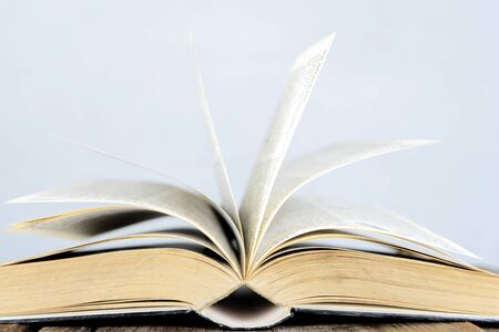 Back to school concept, for educational success. Books that are open, paper looks moving. The background is an empty blackboard that can be put on advertising media.の写真素材