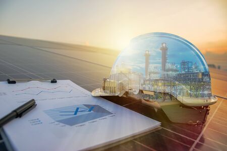 Renewable Energy concept. solar panel Large size that is receiving the sun's rays to produce electric energy, with an engineering expert. The refinery is working in a double exposure.の写真素材