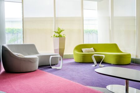 Reception room. interior of a waiting room, modern office, corridor with two sofa.の写真素材