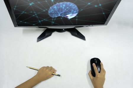 Innovative Learning concept. Child's hand holding a mouse to operate computer and other equipment...