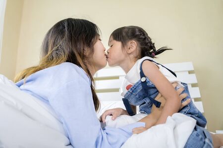Asian women, pretty face, her sister and her sister ties a lot, show their love by kissing each...