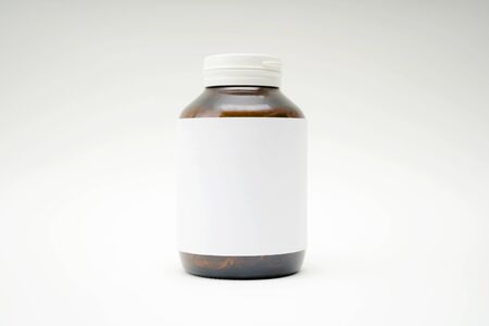 Closeup of Medicine bottle, brown glass bottle style, white label flooring, text input, image, advertising media.の写真素材