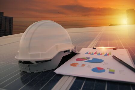 Energy concept. working solar station photovoltaic panels,Science solar energy,engineer working on checking and maintenance equipment at industry solar power,Chart Section Power consumption.の写真素材