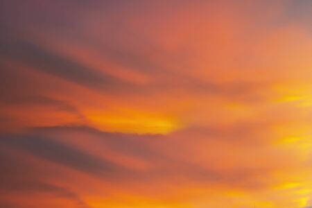 Fiery orange sunset sky. Beautiful sky. Sunset sky cloud background. Beautiful stormy sunset sky. Cloudy abstract background. Sunset colors.の写真素材
