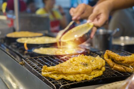 Streetfood in south east asia concept. Fried food with sticks, Thai style food, Thailand street food ,Bangkok. Fried shells, hot pansの写真素材