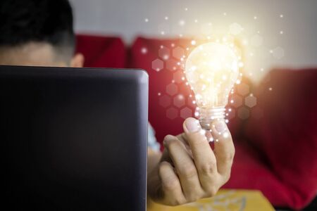Innovative idea in businessman hand.  ideas of new ideas with innovative technology and creativity.の写真素材