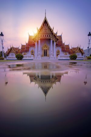 Marble Temple of Bangkok, Thailand. The famous marble temple Benchamabophit. Is a popular tourist destination in Bangkok. And is an important Buddhist place. Evening atmosphere. Vertical image.の写真素材
