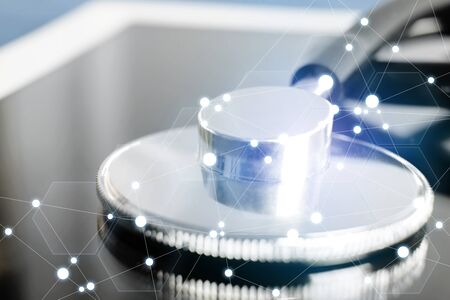 Stethoscope head is placed on the tablet closeup.  Medical care, help or insurance,equipment shop or store concept. Physician waiting for patient to examine. at worktable in doctor office.の写真素材