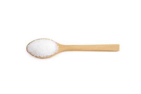 White sugar placed in a wooden spoon, food concept.  backdrop isolated on white background.の写真素材