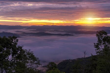 Dawn of Sea Fog on the top of the Sierra at Doi Samer Dao, Nan, Beautiful summer landscape in the mountains at thailand. Sunsetの写真素材