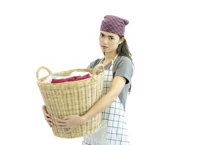 Asian people are doing housework, she is washing clothes and she is very tired of working. Facial expression, White isolated backgroundの写真素材
