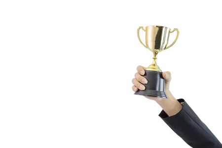 Business women hold a trophy showing success until receiving the award, Champion golden trophy for winner,

White isolated backgroundの写真素材