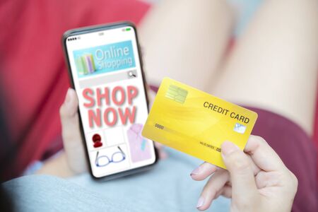 Online Shopping Website on smartphone concept. Easy E-commerce Website Shop by Smartphone. Close up Hands Using Smartphone Shopping Cart read Online Article, Blog. Digital Payment gatewayの写真素材