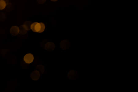 Gold abstract bokeh dark backgroundの写真素材