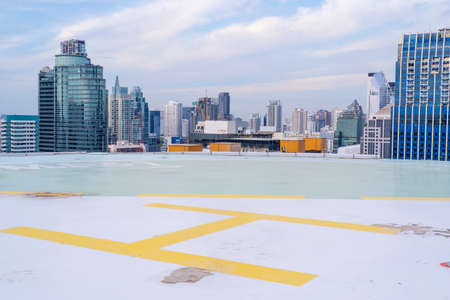 Helipad on the roof of a skyscraper with cityscape viewのeditorial素材