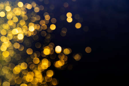 Abstract Golden glare on abstract bokeh background. Gold abstract bokeh background.の写真素材