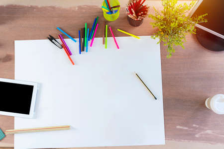 Creative design top view concept. Blank paper with stationeryの写真素材