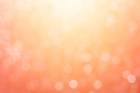 Abstract sunny bokeh on orange backgroundの写真素材