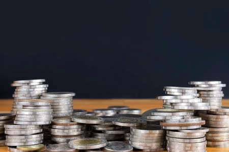 Concepts of financial business investment. A pile of coins stacked in numbers, the back area is empty for ad textの写真素材