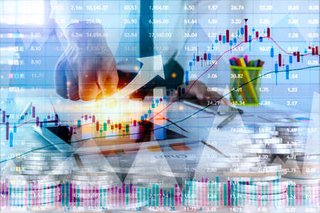 Double exposure of graph and rows of coins for finance and business concept