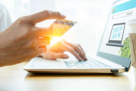 Online Shopping Website on Laptop. Easy E-commerce Website Shop Laptop. Close up Hands Using Shopping Cart read Online Article, Blog. Digital Payment gatewayの写真素材