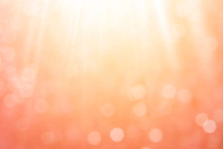 Abstract sunny bokeh on orange backgroundの写真素材