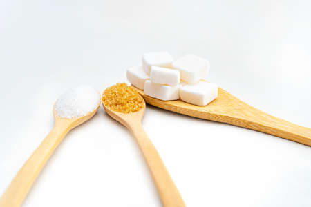 Spoon scoop brown sugar, Sugar cubes and white sugar Isolated on white backgroundの写真素材