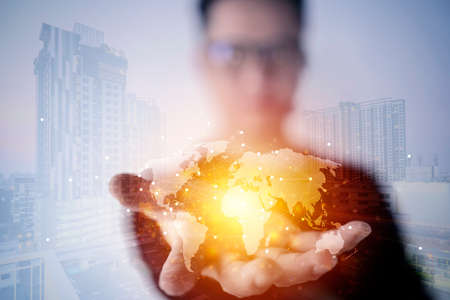 Businessman holding global network and data exchanges over the world 3D rendering. Whole world in...
