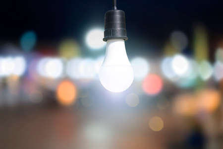 Light Bulb, world environment day concept. Abstract blur colorful bokeh city lights over, During the night the bright lights.の写真素材