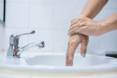 Wash your hands, soap your hands. Women's hands are washed with soap. Hand hygiene, skin care, disinfection. Soaping your hands with antibacterial soapの写真素材