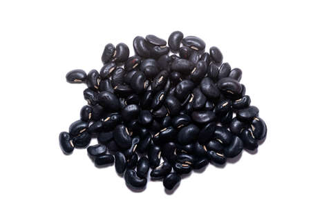 Pile of black beans isolated on white backgroundの写真素材