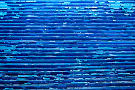 Corrugated plastic sheet or PP Flute Board (polypropylene board). Blue background with stripe effect. The old condition is very decayed.の写真素材