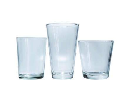 3 empty glasses of various sizes on a white backgroundの写真素材