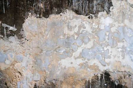 Old weathered brick wall fragment, use as background.の写真素材