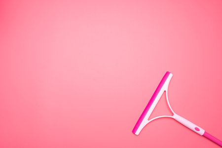 Pink plastic pvd cleaning with squeegee, can put message for communication.の写真素材