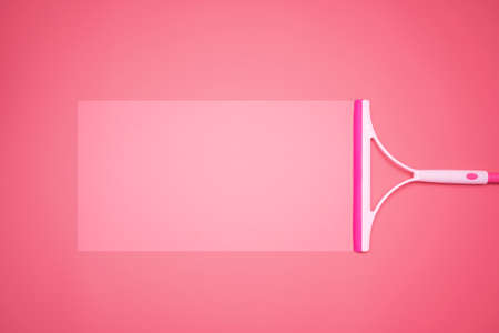 Pink plastic pvd cleaning with squeegee, can put message for communication.の写真素材