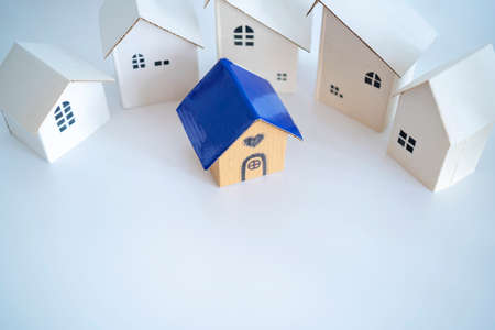 Search and selection of homes for purchase or rent. Many house models and one with heartの写真素材