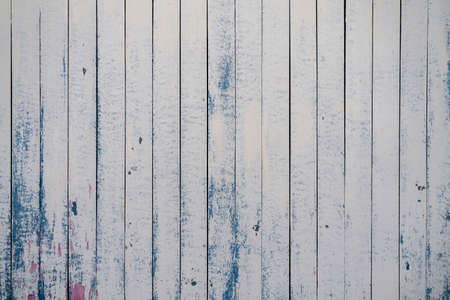 white old wooden fence. wood palisade background. planks textureの写真素材