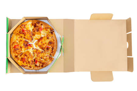 Pizza in a cardboard box against a white background. View from above. Pizza delivery. Pizza menu.の写真素材
