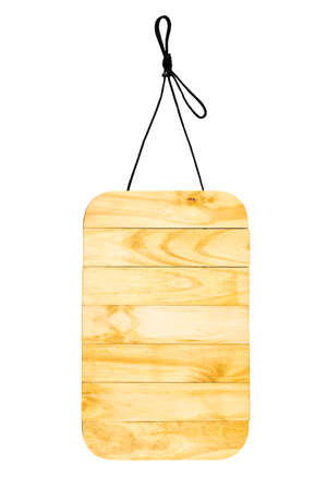 Wooden sign with natural pattern with rope hanging on black space with empty space.の写真素材