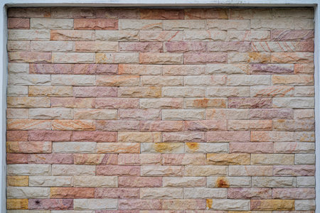 Wide beige brick wall background texture. Home and office design backdrop. Natural material abstract structure backdropの写真素材
