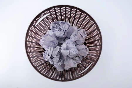 The crumpled paper that was thrown into the trash As if you were throwing away a good idea, missing a good opportunity.の写真素材