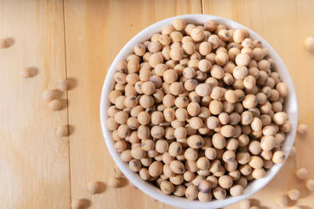 Soybean or soya bean in a coffee mug on a wooden table.の写真素材