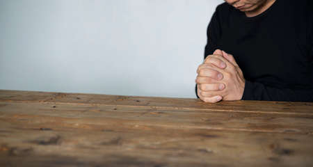 Praying man hoping for better. Asking God for good luck, success, forgiveness. Power of religion,...