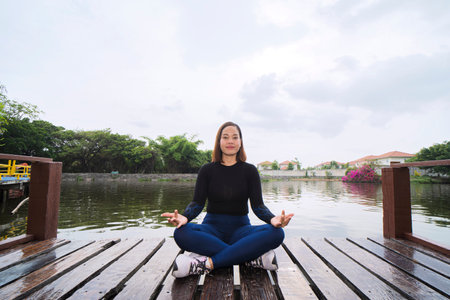 Lifestyle woman yoga exercise and pose for healthy life. Young girl or people pose balance body vital zen meditation for workout nature background in morning sunriseの写真素材