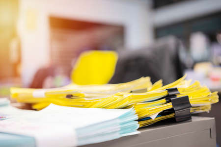 extreamely close up stacking of office working document with paper clip folder