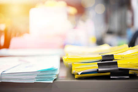 Stack of report paper documents for business desk, Business papers for Annual Reports files,...